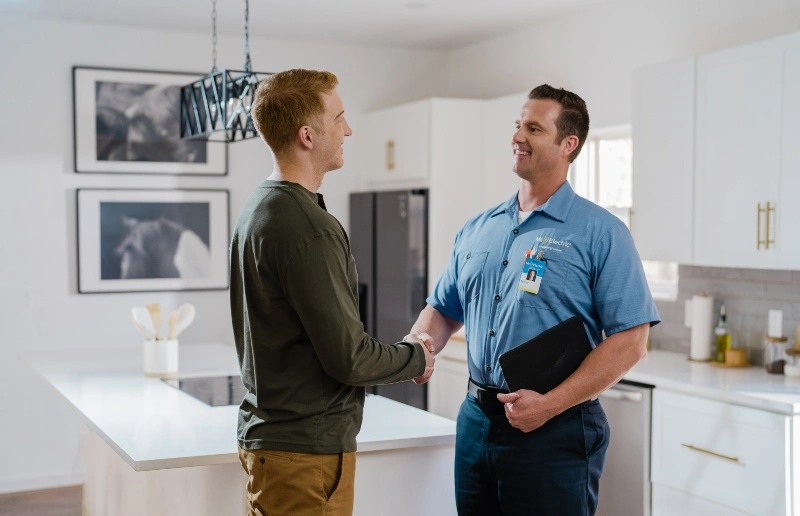 A Mr. Electric of Virginia Beach electrician and customer during a residential service appointment.