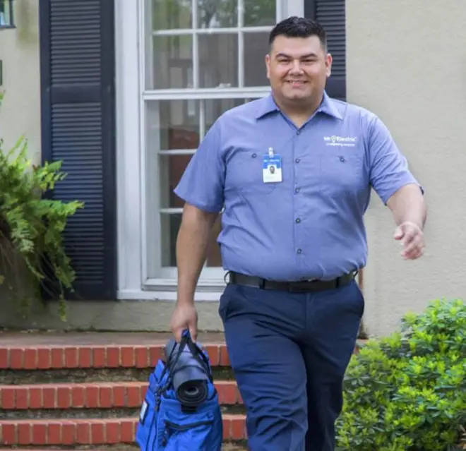 mre technician walking towards a customer.