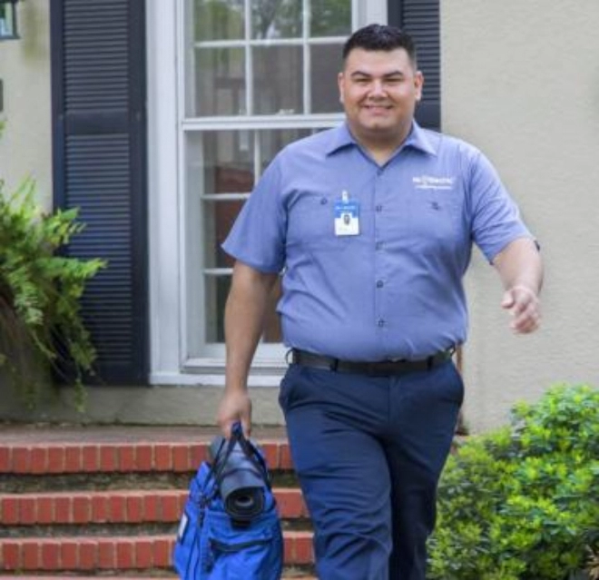 mre technician walking towards a customer.