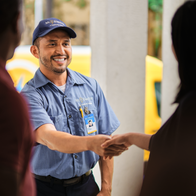 Electrician greeting customer.