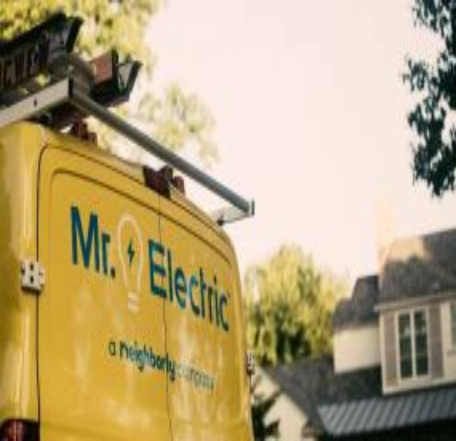 Rear view image of a Mr. Electric van at a customer's home.