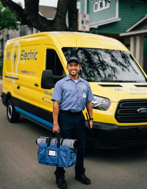 Smiling MRE technician in front of van.