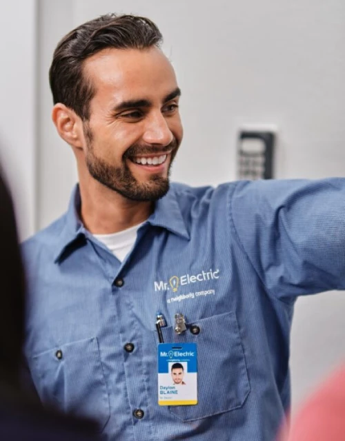 Mr. Electric technician smiling.