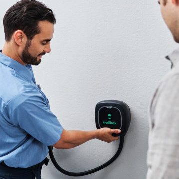 MRE electrician installing electric vehicle charger.