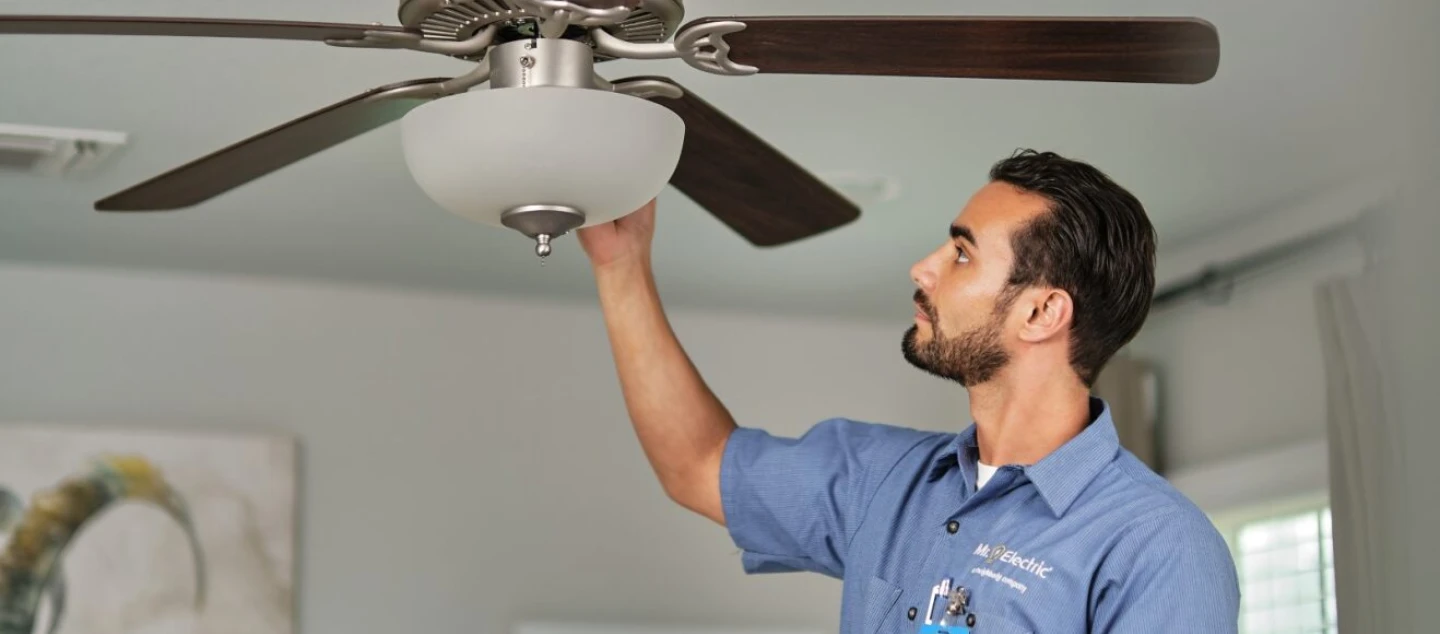 Mr. electric technician working on an electric fixture.