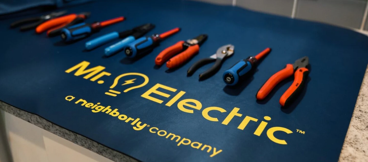 Mr. Electric electrical repair tools spread across a counter.