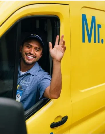 Mr. Electric electrician waving from truck