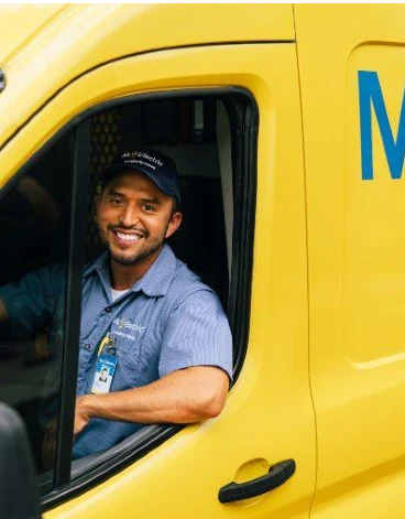 Mr. Electric electrician sitting in truck