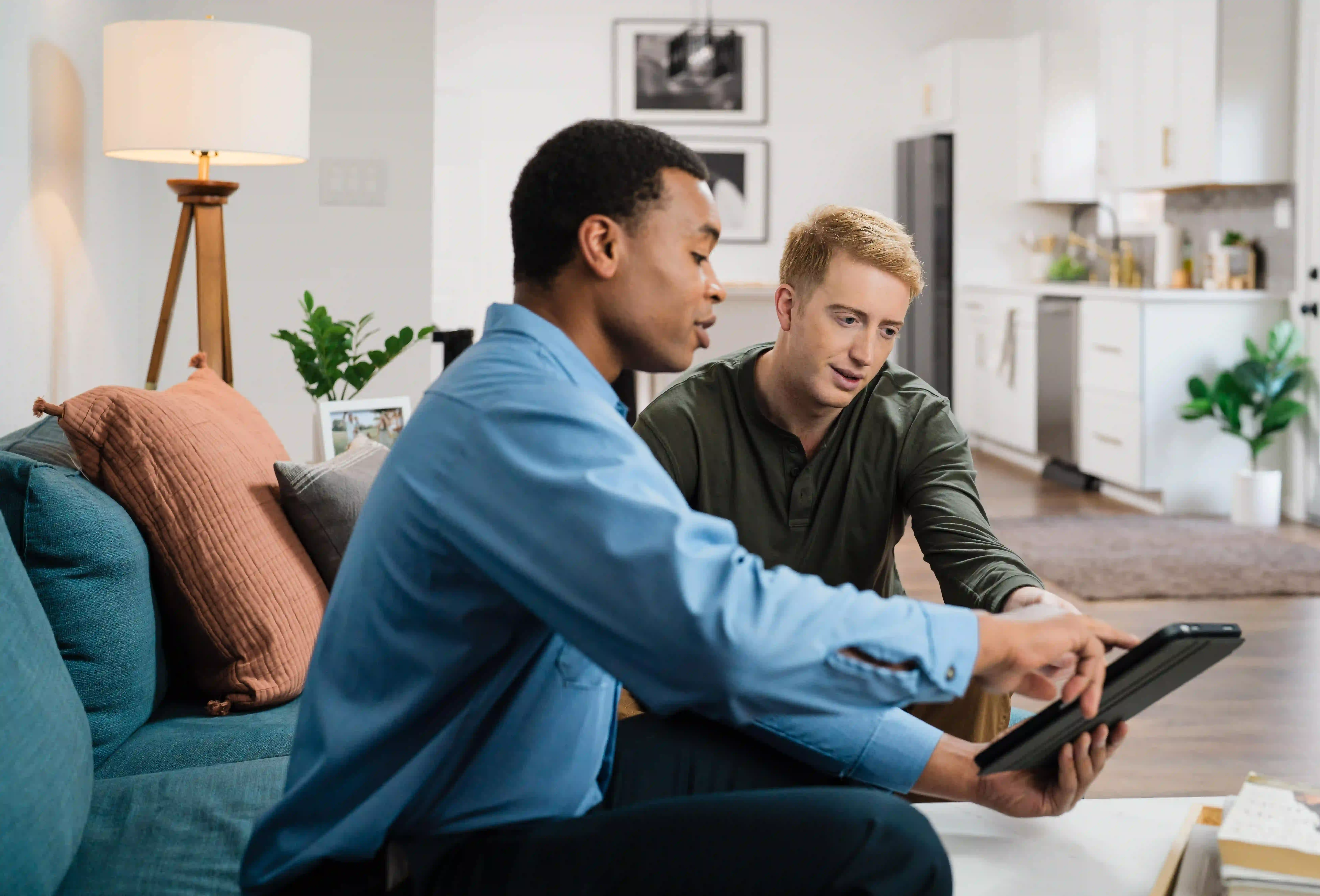 Mr. Electric of Wichita electrician reviewing power conditioner installation details with a customer.