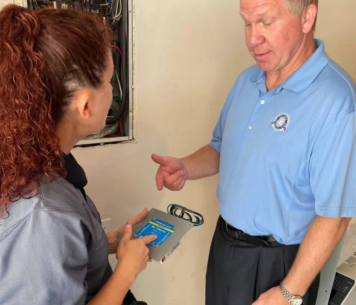 mre technician discussing about electrical panal.