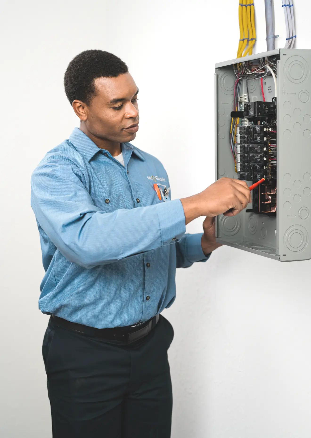 Electrician working on electrical panel for 240v outlet installation