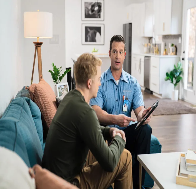 Mr. Electric of Wichita electrician explaining to customer about EV charger installation.
