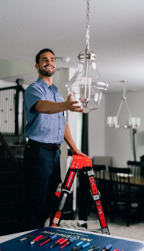 Mr. Electric electrician installing lighting