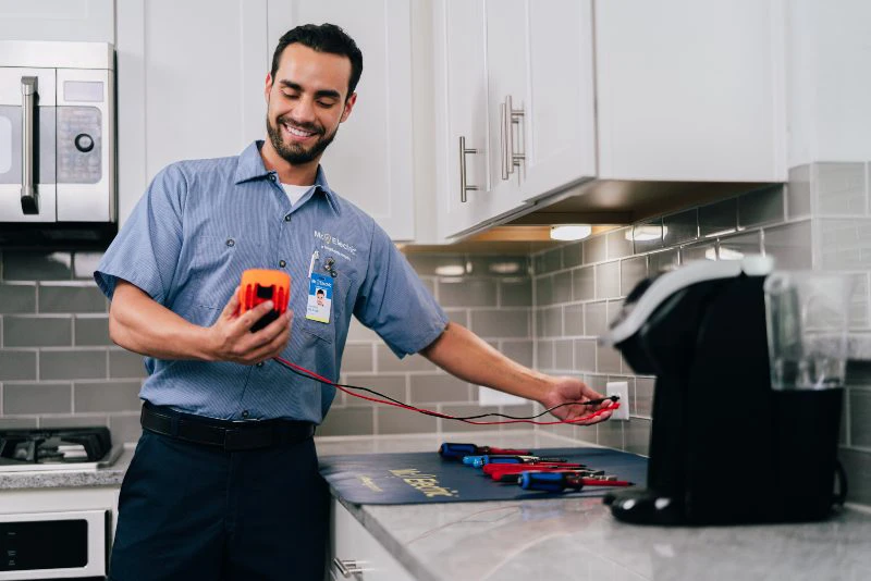 Mr. Electric of South Charlotte electrician testing electricity outlet