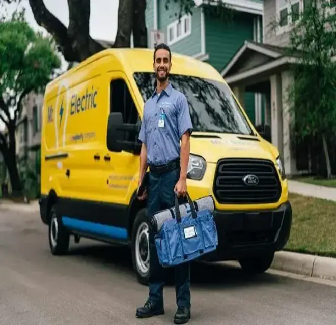 Smiling MRE technician in front of van.