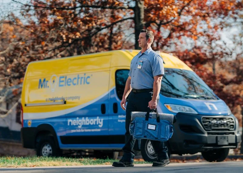 A Mr. Electric electrician arriving to perform interlock kit services