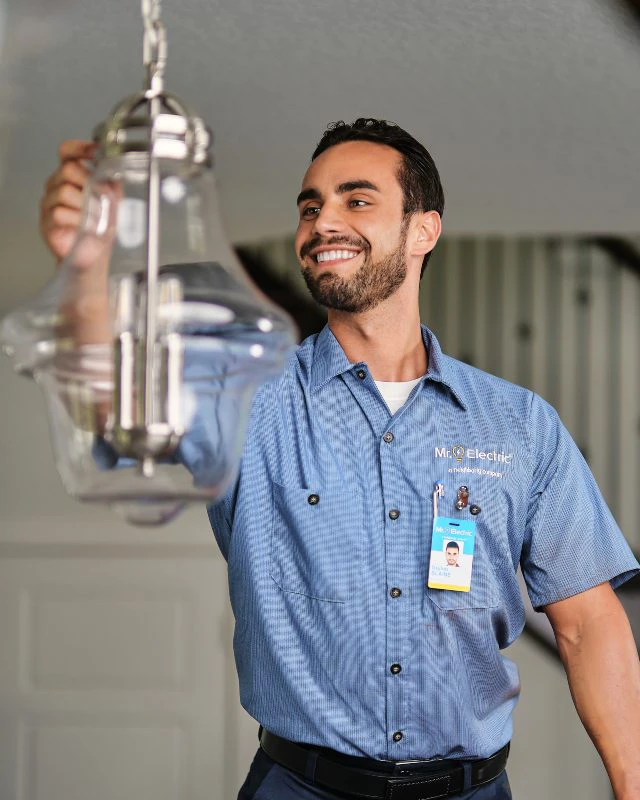 Mr. Electric electrician repairing an accent light.