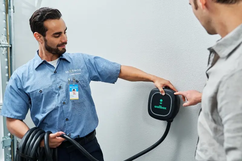 Mr. Electric electrician installing an EV charger