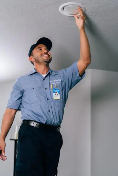 Mr. Electric electrician installing retrofit recessed lighting.