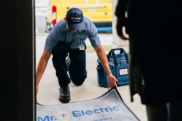 Electricians installing smart doorbells