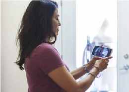 Woman holding smartphone device.