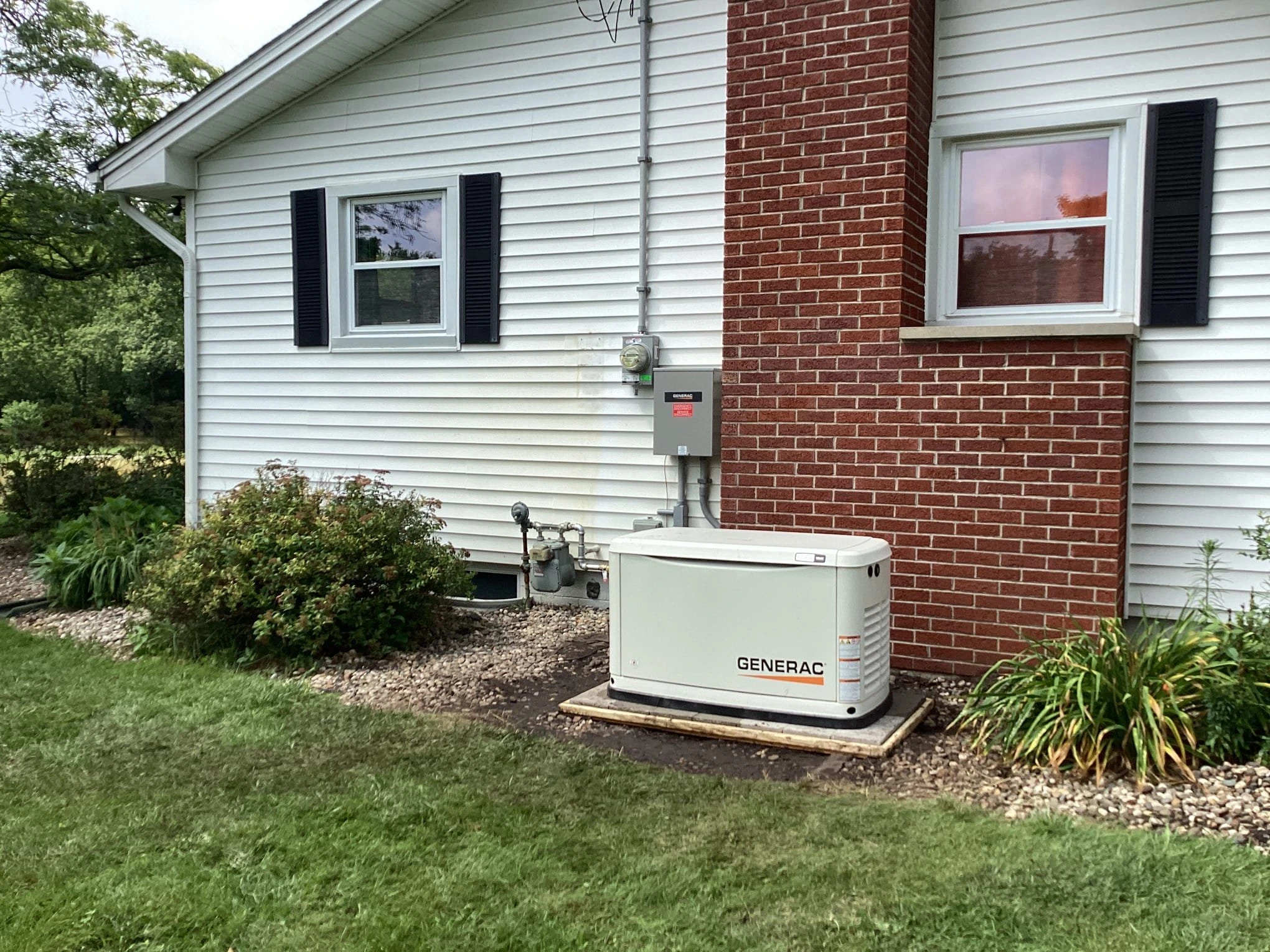 Generac generator by chimney.