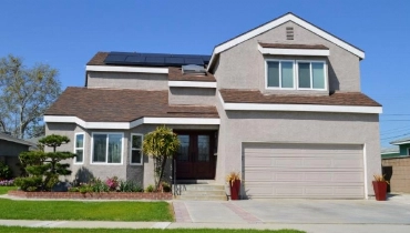 Residential home with solar panels on the roof.